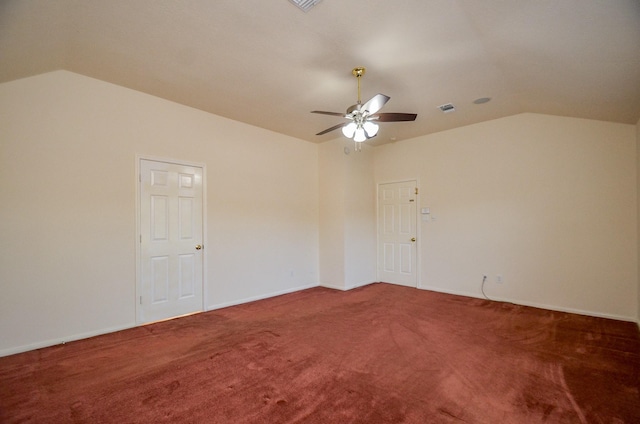 carpeted empty room featuring ceiling fan and vaulted ceiling