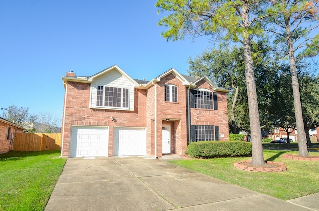 view of front of property featuring a front yard and a garage