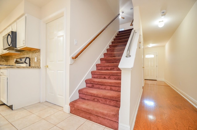 stairway featuring tile patterned floors