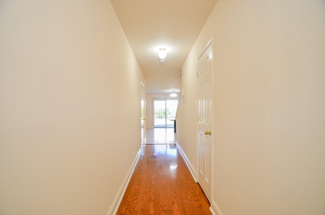 corridor featuring light hardwood / wood-style floors