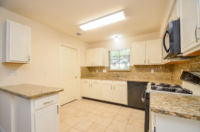 kitchen featuring white cabinets, black dishwasher, light tile patterned floors, and white gas range oven