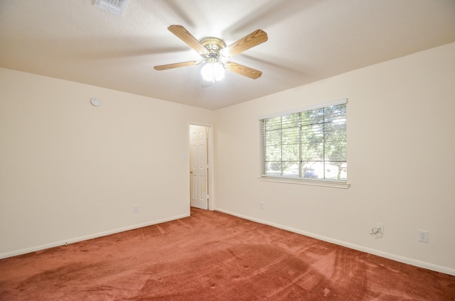 spare room with carpet flooring and ceiling fan