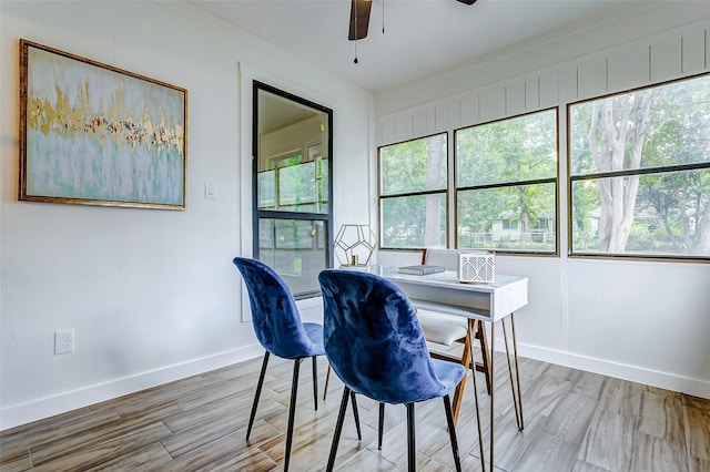 dining area with ceiling fan and hardwood / wood-style floors