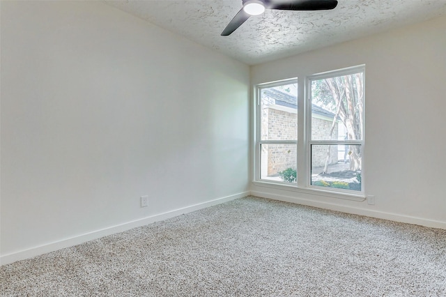 unfurnished room featuring a textured ceiling, carpet floors, and ceiling fan