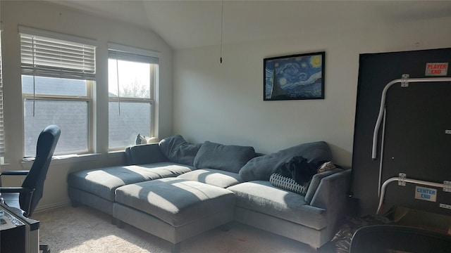 carpeted living room featuring lofted ceiling