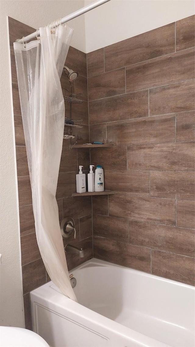 bathroom featuring shower / bath combination with curtain