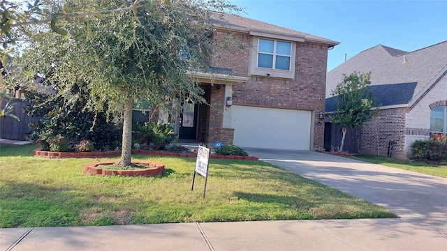 view of front of home featuring a front yard and a garage