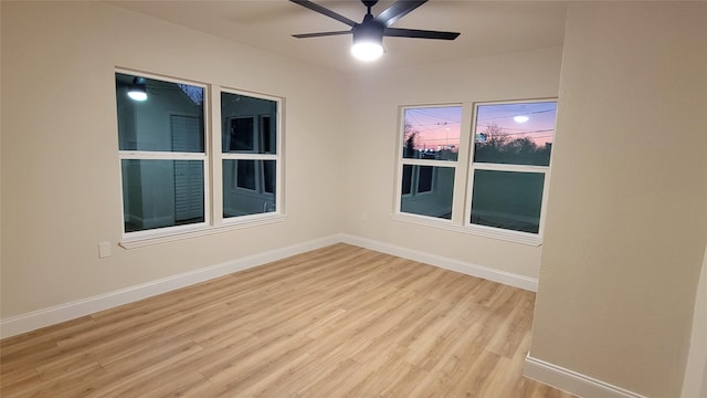 unfurnished room with ceiling fan and light wood-type flooring