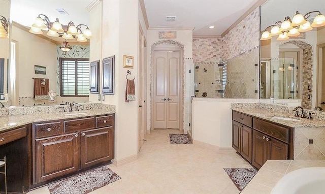 bathroom with vanity, an inviting chandelier, crown molding, tile patterned flooring, and separate shower and tub