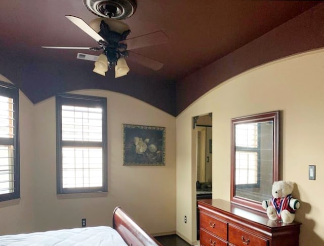 bedroom with ceiling fan and lofted ceiling