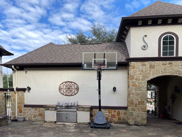 view of patio featuring exterior kitchen