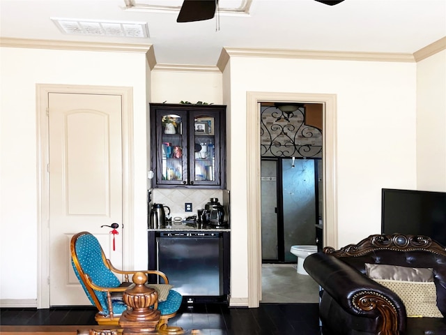 interior space with refrigerator, crown molding, ceiling fan, tasteful backsplash, and dark hardwood / wood-style flooring