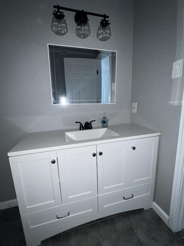 bathroom with tile patterned floors and vanity