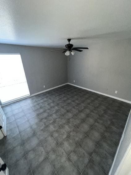 spare room with ceiling fan