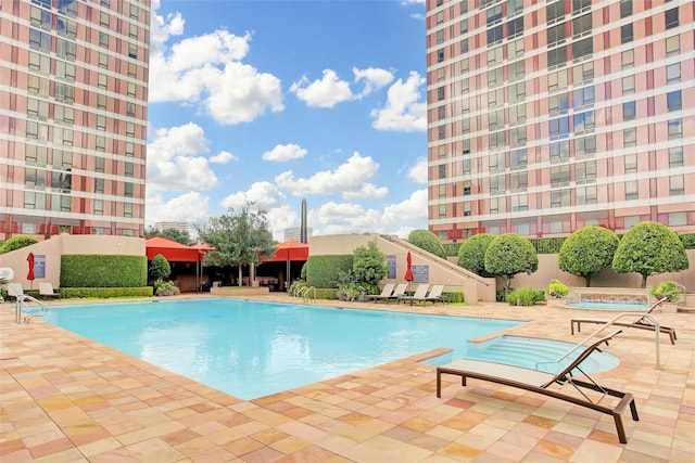 view of swimming pool with a patio area