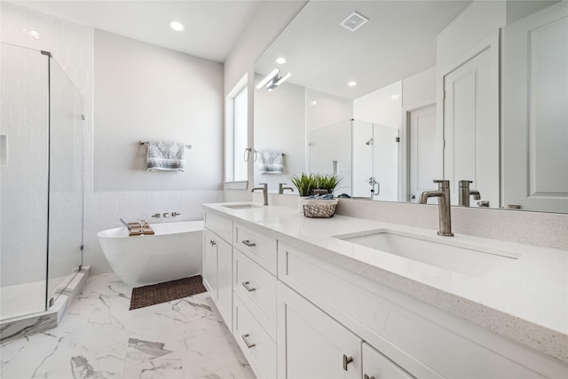 bathroom with vanity and separate shower and tub