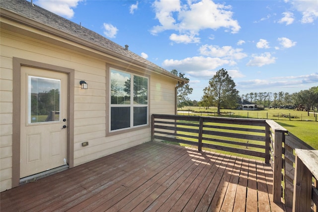 wooden terrace featuring a yard