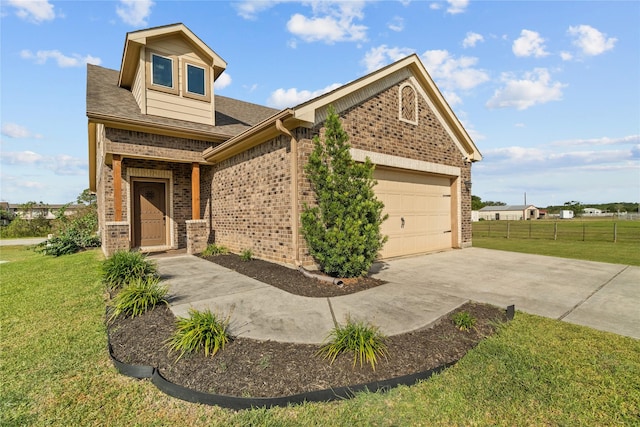 craftsman-style house featuring a garage and a front lawn