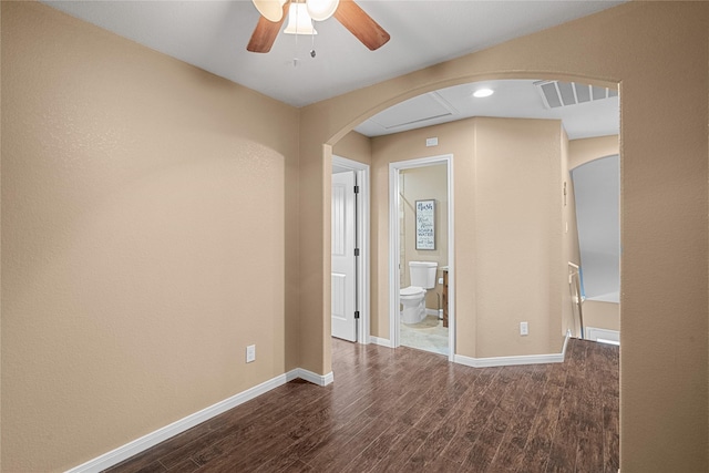 spare room featuring wood-type flooring and ceiling fan