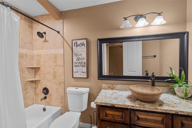 full bathroom with vanity, shower / bath combo, and toilet