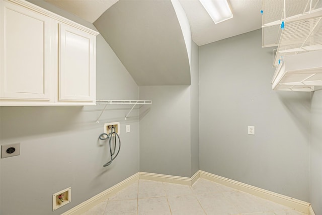 laundry room with light tile patterned floors, washer hookup, electric dryer hookup, and cabinets