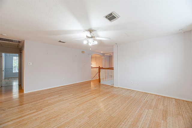 spare room featuring light hardwood / wood-style floors and ceiling fan