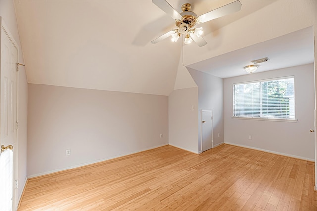 additional living space with vaulted ceiling, ceiling fan, and light hardwood / wood-style floors