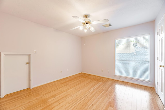 spare room featuring ceiling fan and light wood-type flooring