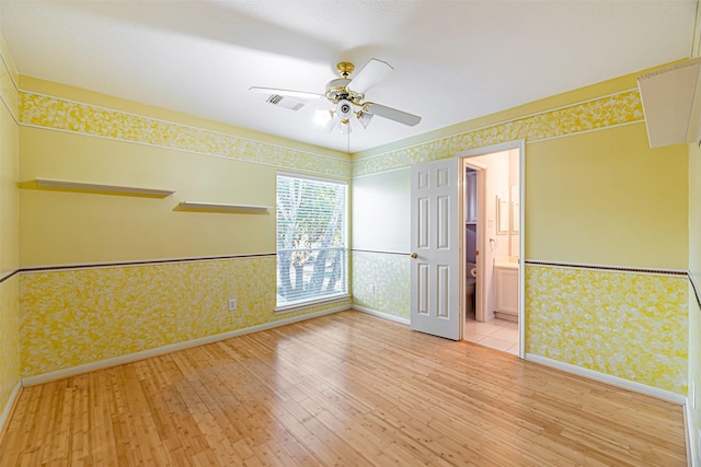 empty room featuring light hardwood / wood-style floors and ceiling fan