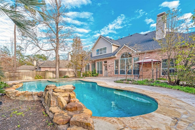 view of swimming pool featuring a patio area