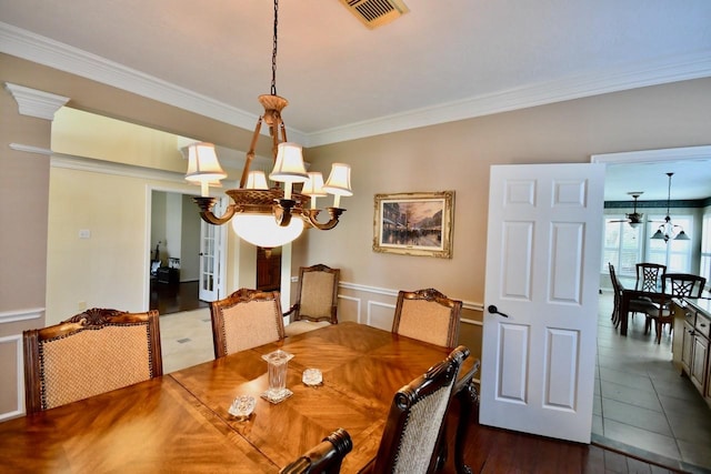 3803 Dewalt Way, Missouri City, TX 77459 - dining space with ornamental molding, dark wood-type flooring, and an inviting chandelier