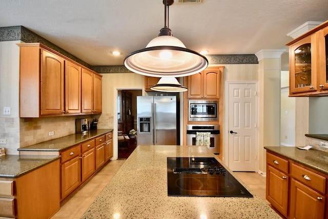 3803 Dewalt Way, Missouri City, TX 77459 - kitchen featuring appliances with stainless steel finishes, backsplash, decorative light fixtures, and dark stone countertops