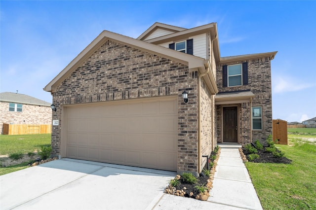 view of front of property with a front lawn and a garage