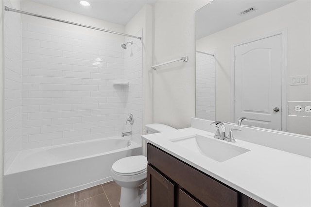 full bathroom featuring tile patterned flooring, vanity, toilet, and tiled shower / bath