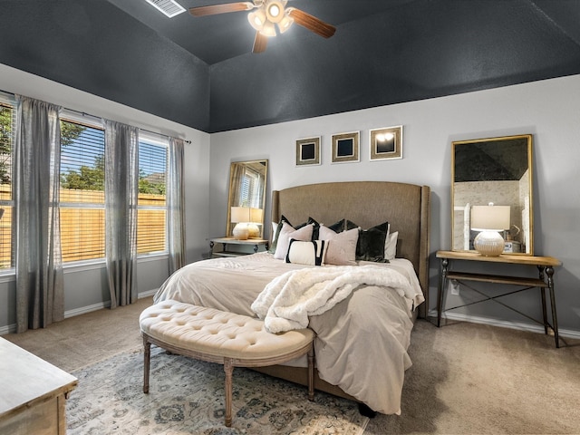 bedroom with ceiling fan, carpet floors, and high vaulted ceiling