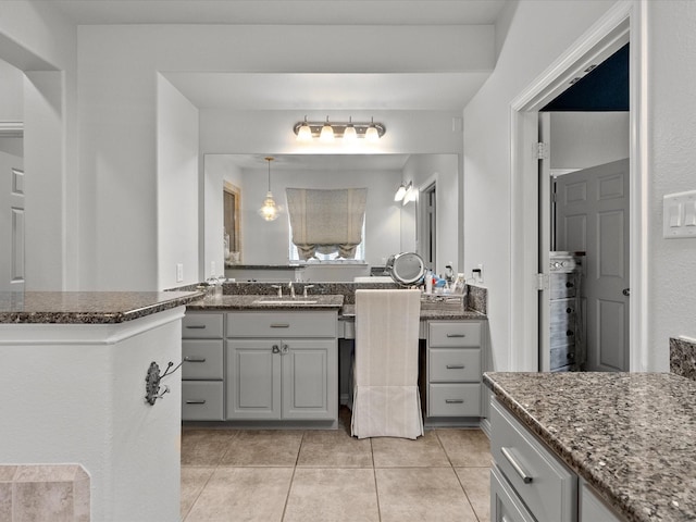 bathroom featuring tile patterned flooring and vanity