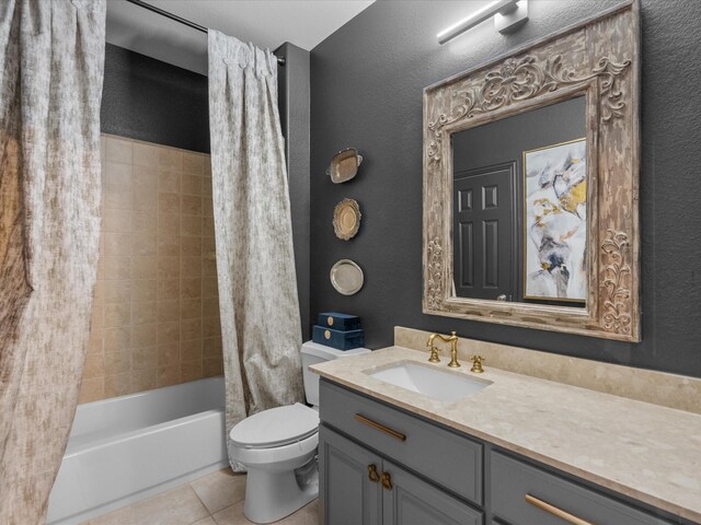 full bathroom featuring tile patterned floors, vanity, shower / bath combination with curtain, and toilet