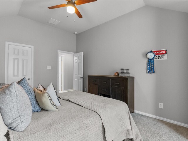 bedroom with ceiling fan, carpet, and lofted ceiling