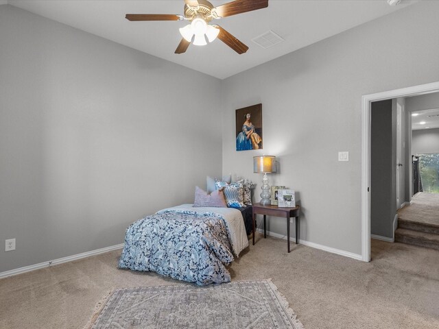 carpeted bedroom with ceiling fan