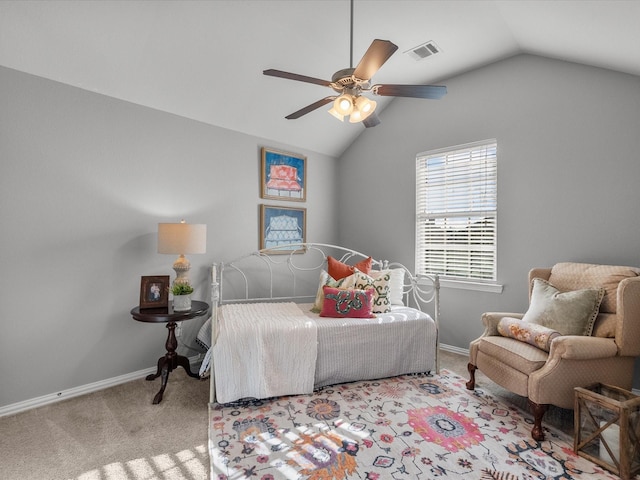 carpeted bedroom featuring ceiling fan and vaulted ceiling