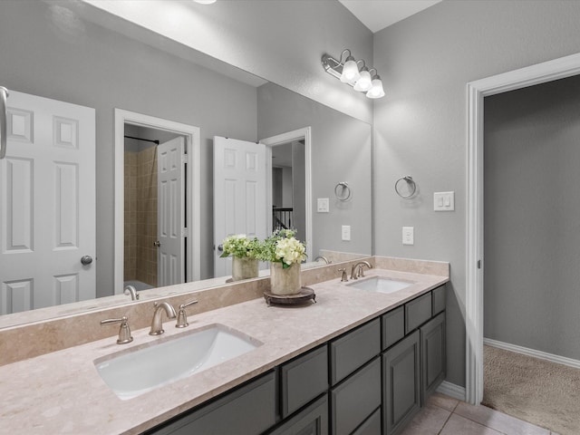 bathroom featuring tile patterned flooring, vanity, and shower / bathtub combination