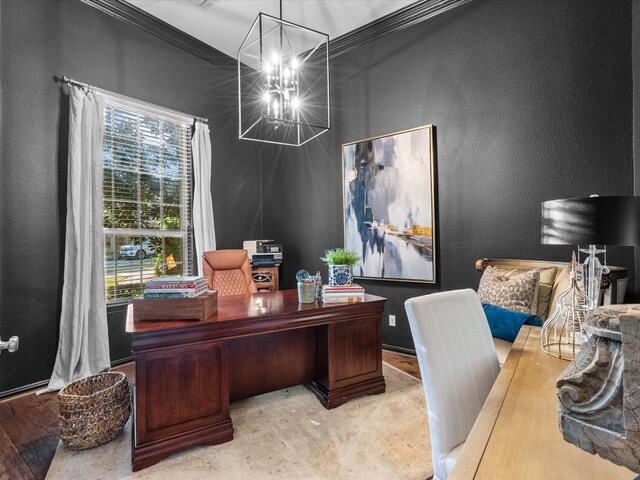 home office featuring ornamental molding, light hardwood / wood-style flooring, and a chandelier