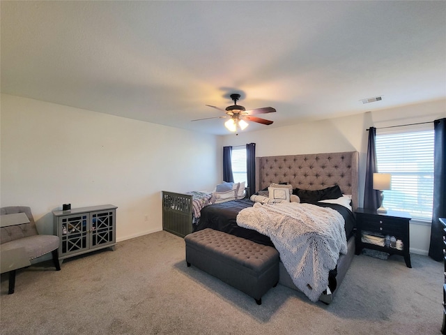 carpeted bedroom with ceiling fan