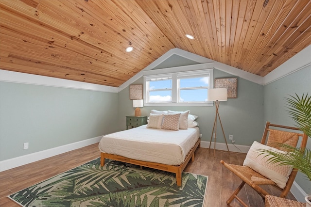 bedroom featuring wood ceiling, vaulted ceiling, and hardwood / wood-style flooring