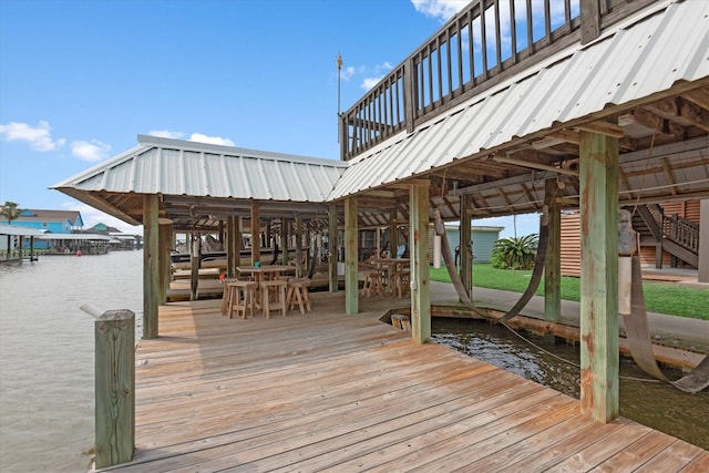 dock area with a water view