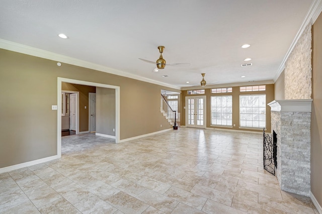 unfurnished living room with a fireplace, ceiling fan, and crown molding