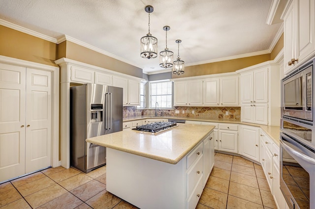 kitchen featuring white cabinets, decorative backsplash, a kitchen island, and stainless steel appliances