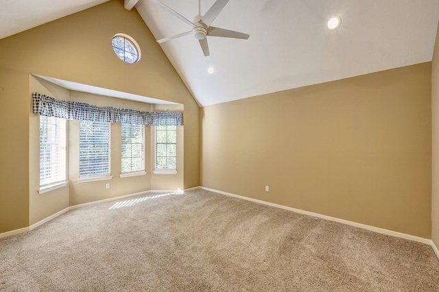 carpeted empty room with vaulted ceiling with beams and ceiling fan