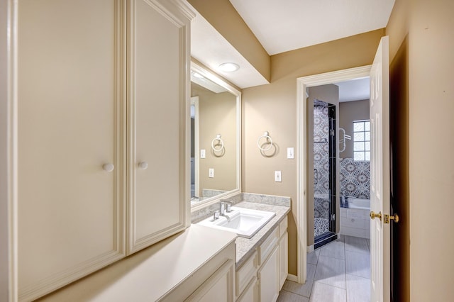 bathroom with tile patterned floors and vanity