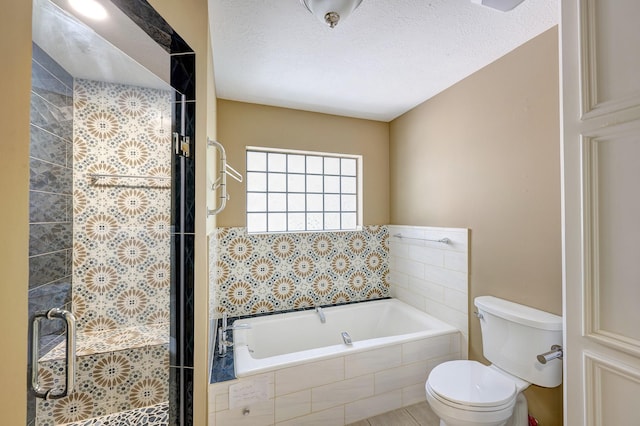 bathroom with shower with separate bathtub, a textured ceiling, and toilet